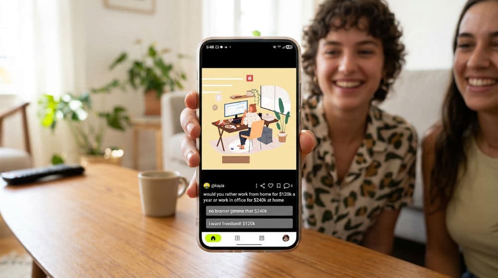 A smartphone displays three Mother's Day card design options for voting on a wooden table.